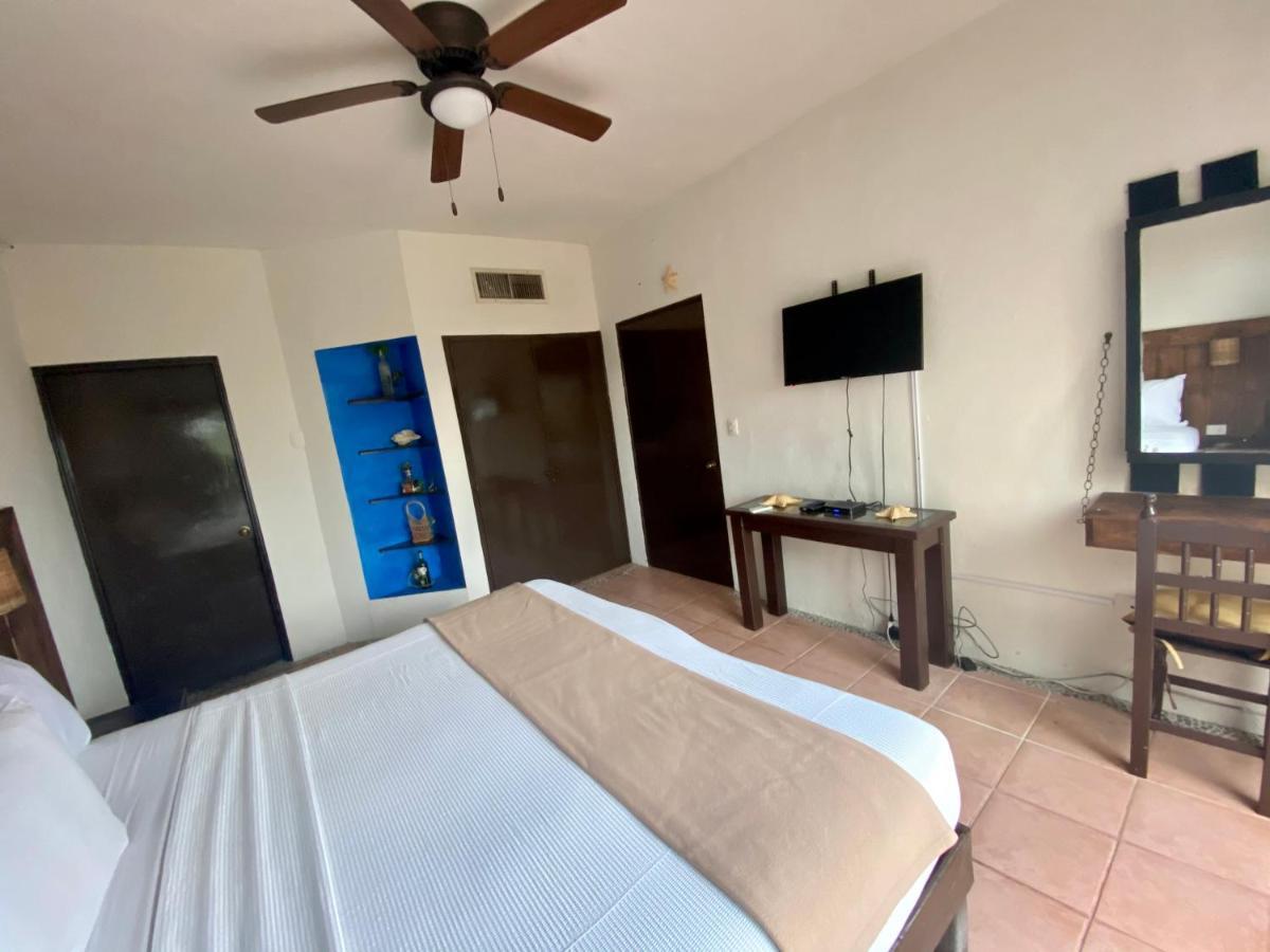 Casa Caribe 칸쿤 외부 사진 A bedroom at the hotel
